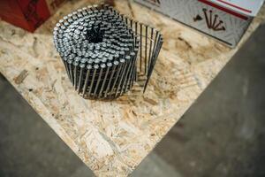 Close up,, view of a bunch of nails on the work bench photo