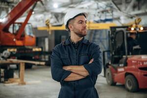 Front, view, standing. Male worker is in the modern warehouse or manufacturing company photo