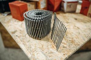 Close, up view of a bunch of nails on the work bench photo