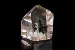 Macro of a mineral, quartz stone on a black background photo
