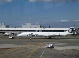 Seattle, WA, 2006 - Commercial Airplane At Airport Terminal With Service People photo