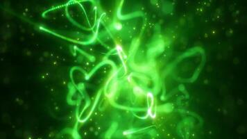 Glowing green light trails and particles creating a dynamic and luminous abstract background video
