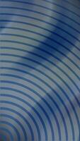 A blue and gray background with a wave pattern video