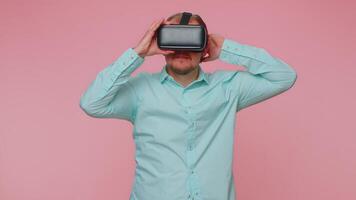 Man using virtual reality futuristic technology VR headset helmet to play simulation 3D game video