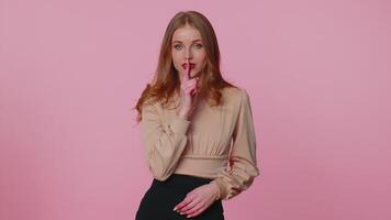 Woman presses index finger to lips makes silence gesture sign do not tells secret, shh be quiet video