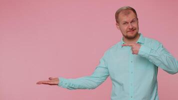 Man pointing empty place, advertising area for commercial text, copy space for goods promotion video