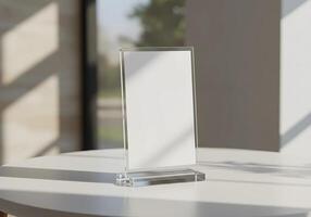 Mockup on Acrylic Stand Displaying a Blank Sheet on a Table 2 photo