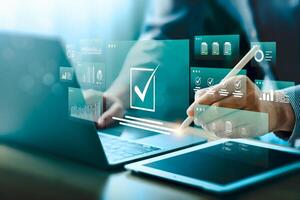 Digital approval and task management with futuristic interface. Businessman using stylus on tablet to complete checklist, analyze data on smart dashboard. Concept of workflow automation, e signature. photo