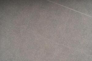 Modern Grey Quartz Surface Texture with Subtle Grain. Natural Stone Texture - Dark Grey with Fine Speckles. photo