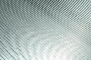 Modern metallic corrugated background with diagonal lines. Metallic plate texture with dust. photo