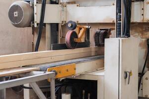 Machine or unit for wood processing at a furniture factory. photo