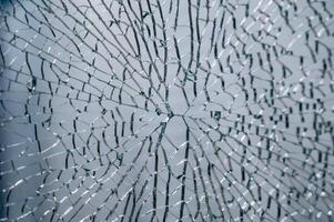 transparent glass, broken into a large number of fragments and parts photo