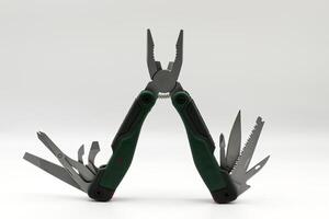 Multi tool with multiple functions and pliers isolated on white background. photo