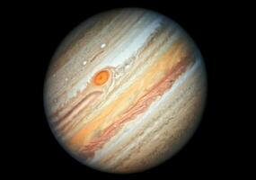 View of the gigantic planet jupiter showing its swirling atmospheric bands and great red spot photo