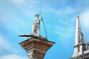 Saint Theodor statue on a column on the Piazza San Marco of Venice in Italy - Colonne di San Teodoro photo