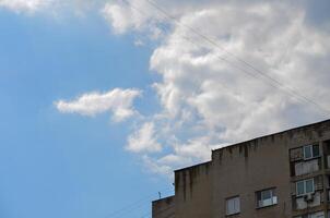 A building with a blue sky in the background. The sky is clear and blue with no clouds photo