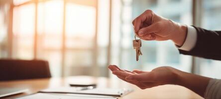 The moment of handing over the keys in a professional business transaction. photo