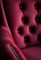 close up of a red chair with buttons on it photo