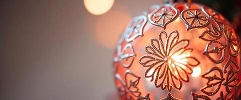 close up of a lit ornament with lights in the background photo