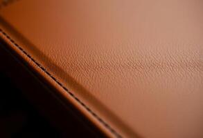close up view of a brown leather surface photo