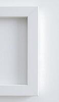 White blank frame on white wall photo