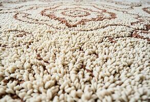 A close up of a rug with a large design photo