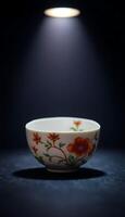 white bowl with a red flower painted on it photo