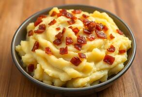bowl of mashed potatoes topped with bacon photo