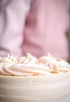 A cake with frosting on top photo