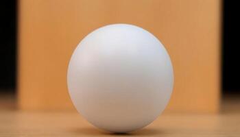 white egg sitting on top of a wooden table photo