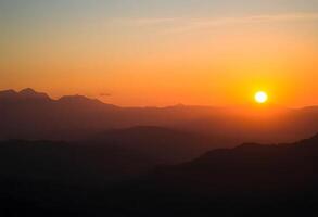 Sunset over the mountains photo