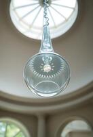light fixture hanging from a ceiling in a room photo