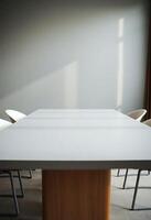 white table with chairs around it in a room photo