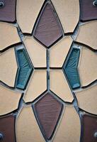 A close up of a tile wall with different colors photo