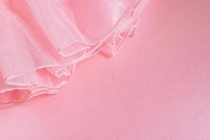 Delicate Pink Fabric with Ruffled Edge A Soft and Romantic Texture Background Design photo