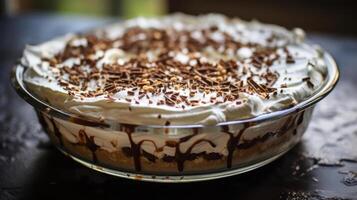Delicious chocolate cream pie with whipped cream and chocolate shavings. photo