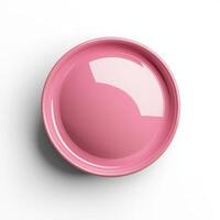 A pink button on a white surface photo