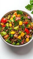 A bowl of mixed vegetables and tomatoes on a white background photo
