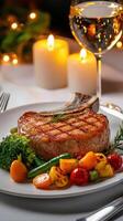 A plate of food with a glass of wine and candles photo