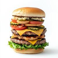 A large hamburger with cheese, tomatoes and lettuce photo