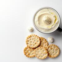 Cream cheese and crackers on white background photo