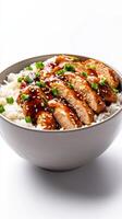 A bowl of rice with chicken and sesame seeds photo