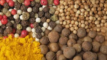 Assorted aromatic, natural and fragrant spices. Pepper, coriander, turmeric. Various variations of spicy Indian and oriental spices for seasoning dishes. video