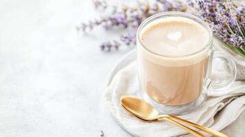 Savor herbal coffee with lavender syrup served in a transparent mug on an elegant table photo