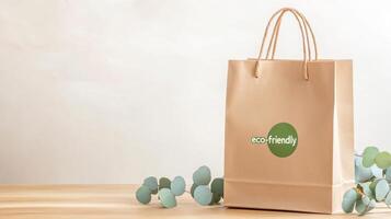 A branded paper bag on a wooden table, surrounded by eucalyptus leaves, highlights eco-friendly choices photo