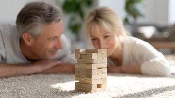 A couple plays Jenga on a cozy rug in a bright living room, filled with suspense and joy, kidults concept, kidults concept photo