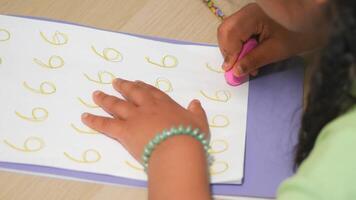 Child practicing number writing activity at home video