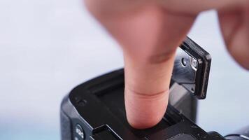 putting a batter in a camera closeup video