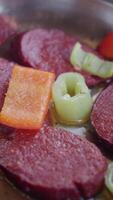 Sizzling meat with colorful vegetables in a skillet video