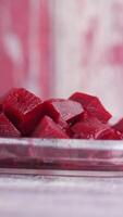 Gelatin dessert preparation with vibrant red cubes video